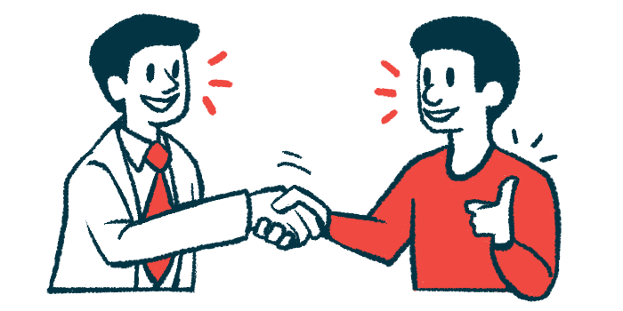 A patient gives a thumbs-up sign while shaking hands with a doctor.