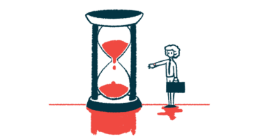 A person carrying a briefcase and standing next to a giant hourglass is seen checking his watch.