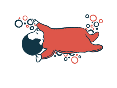 An infant in a red onesie naps with arms and legs outstretched.